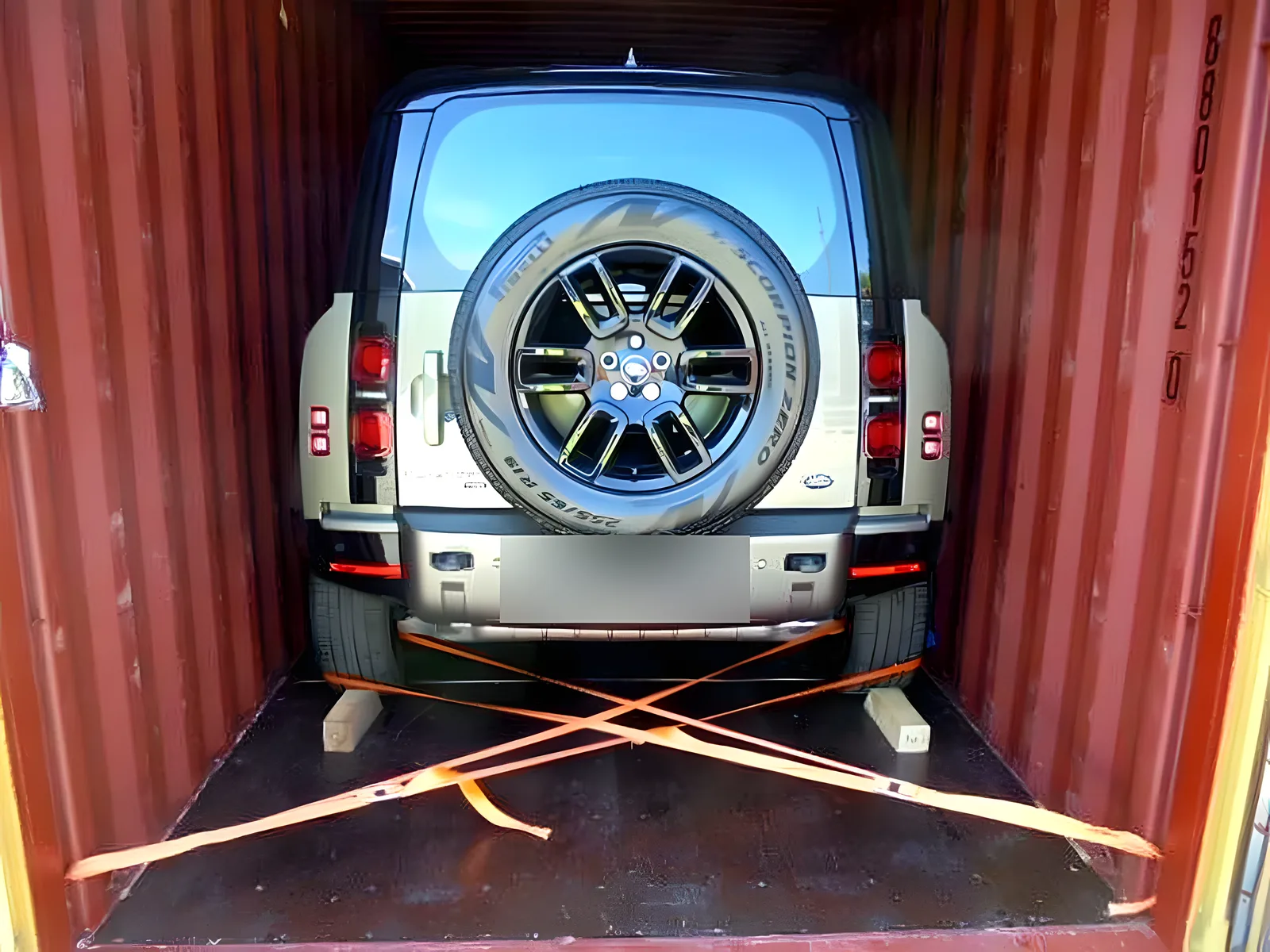 Land Rover Defender in a container