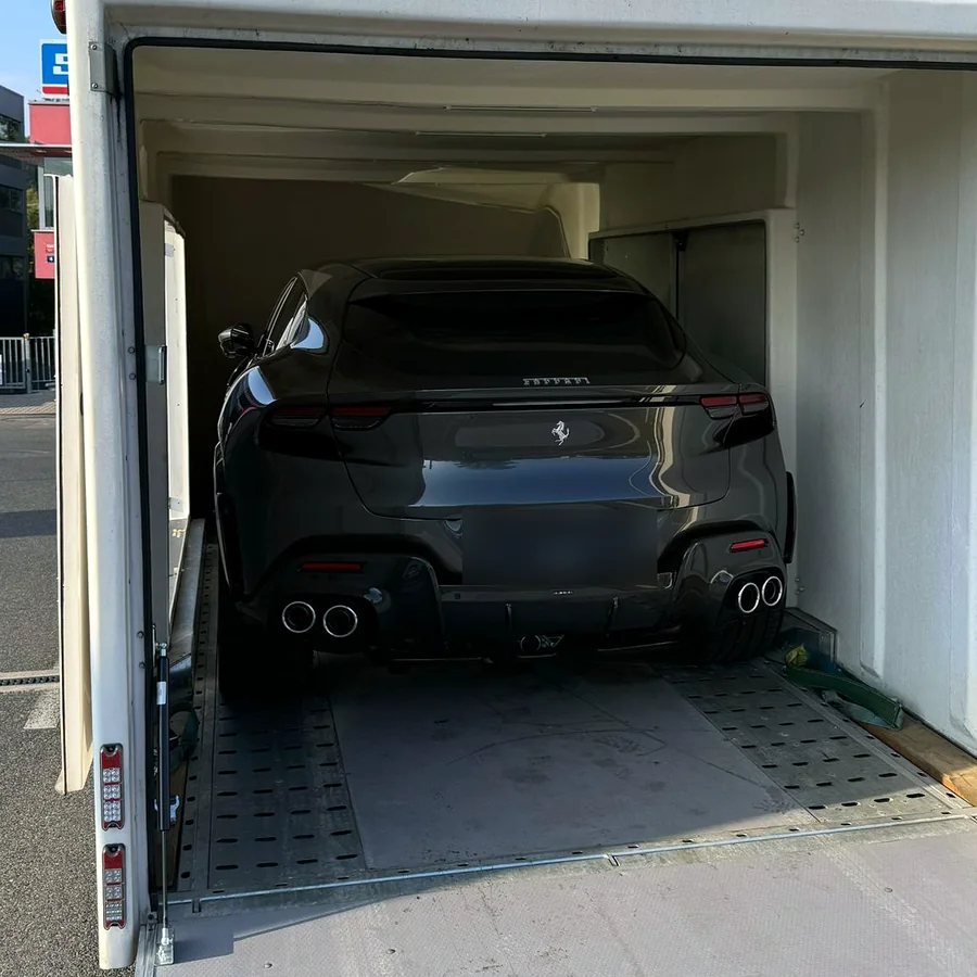 Enclosed trailer loaded with a Ferrari Purosangue